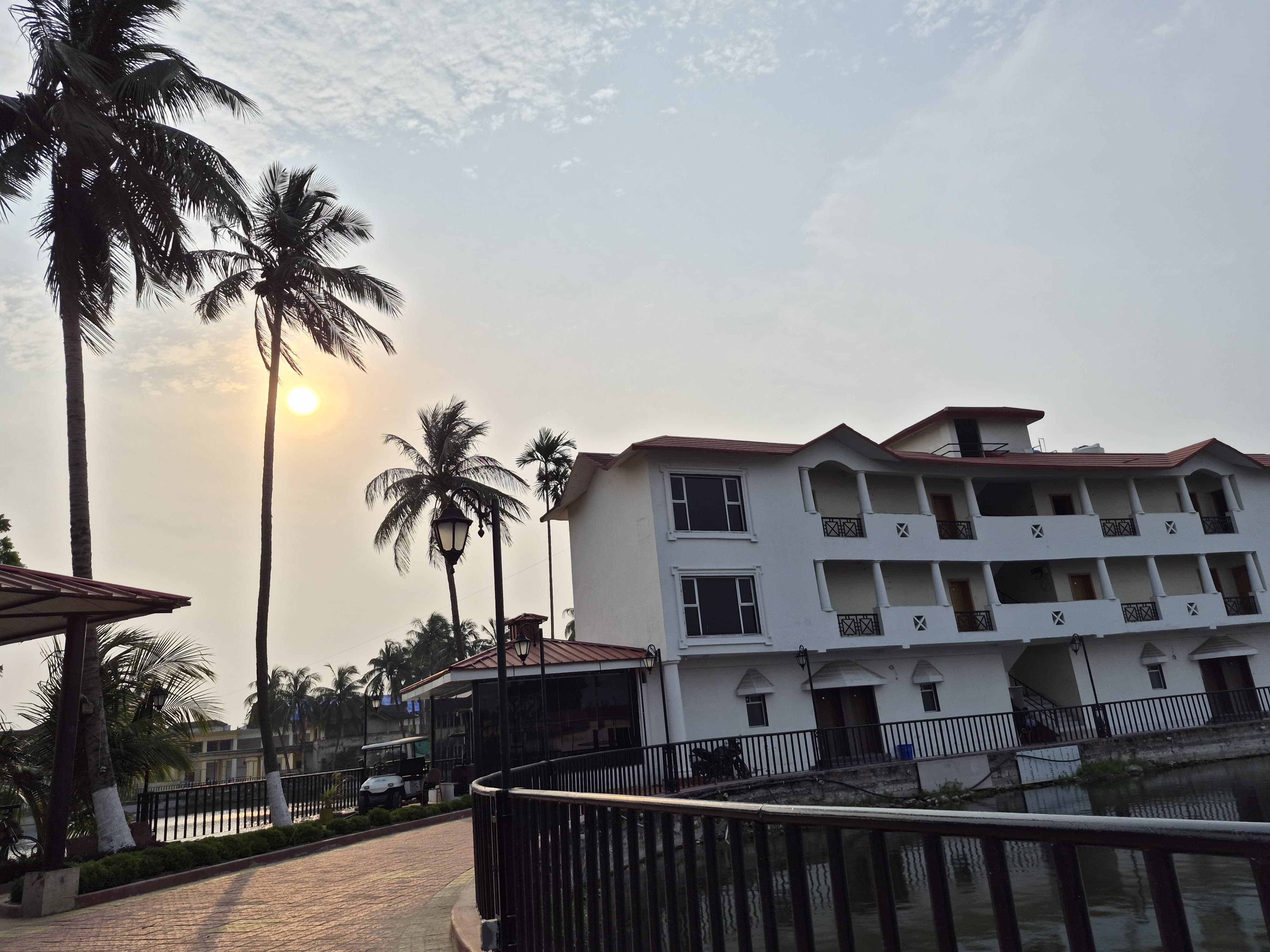 Lake Land resort building with palms
